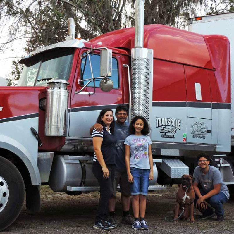 Transcole Express Family standing by their truck