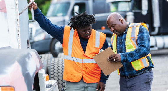 Truckers collaborating in the shipping yard