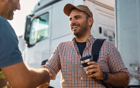 trucker-shaking-hands Best Fuel Card for Truckers