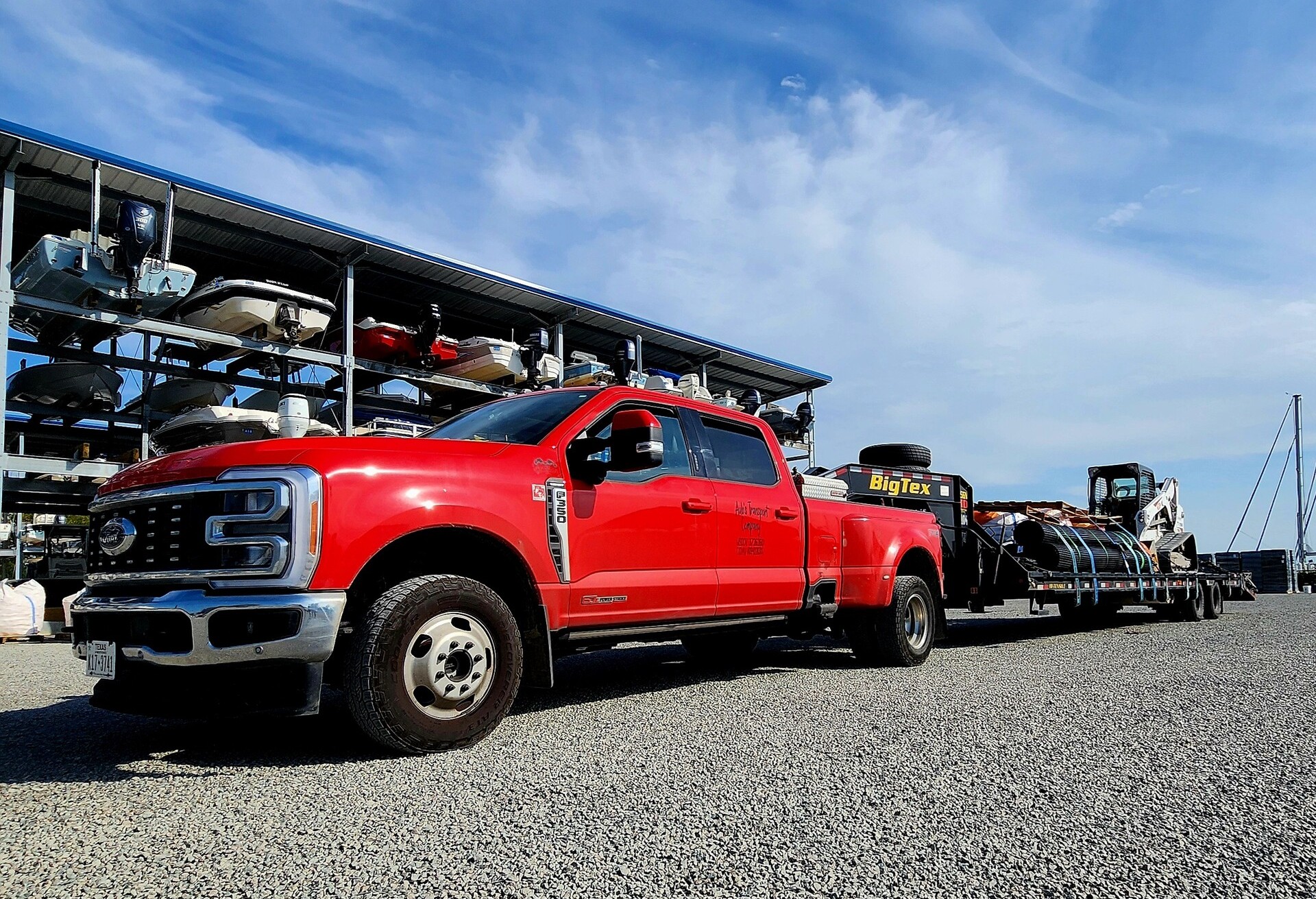 Aubs_Transport_Company2 (1) Aubs Transport red four door dually hauling a gooseneck trailer.