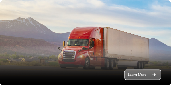 Freight-Factoring-industry Red semi truck hauling a trailer on a road with mountains and open landscape in the background